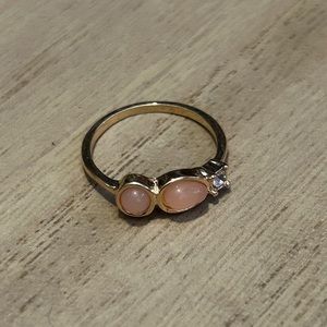 Gold ring with pink stones and one gem, size 6